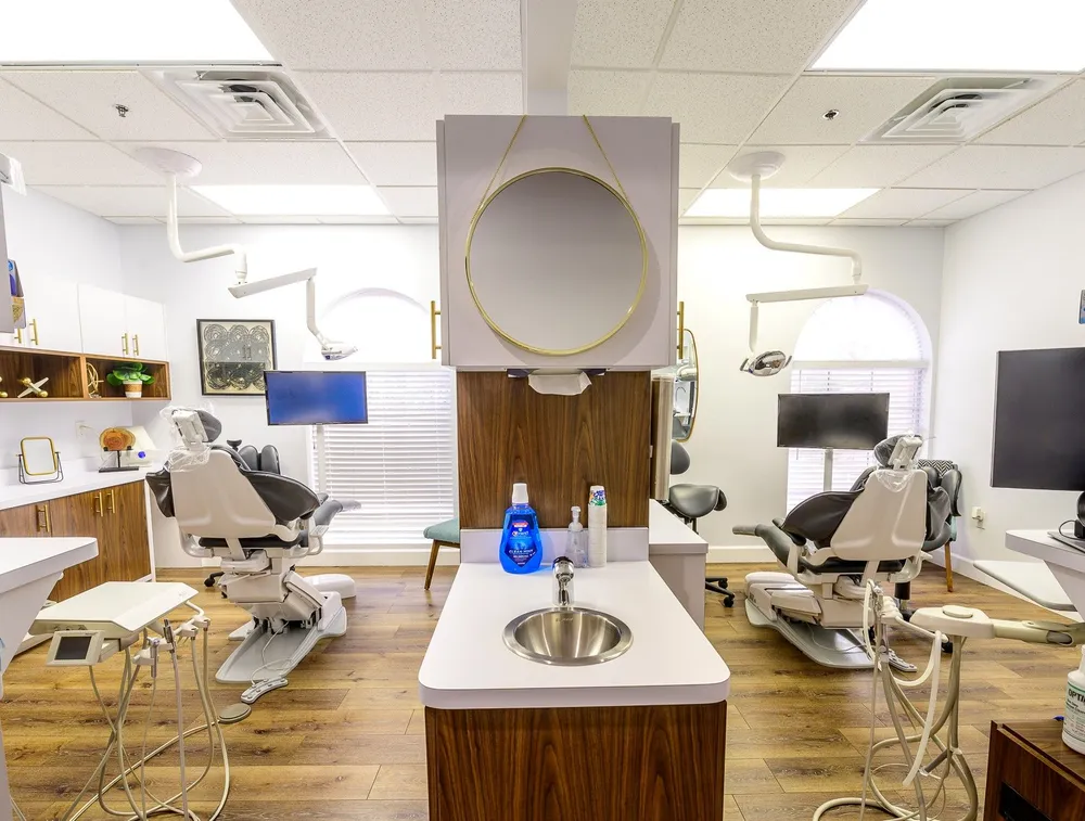 Two dental exam rooms side by side at Joshua M. Ignatowicz DMD and Associates