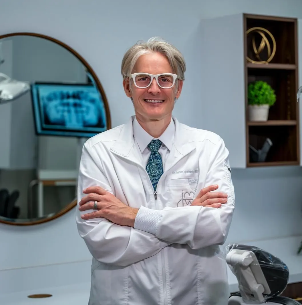 Dr. Joshua M. Ignatowicz smiling in a professional photo at the dental practice in Henderson NV