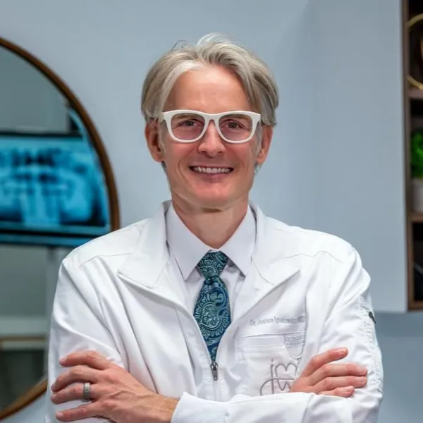 Dr. Joshua M. Ignatowicz smiling in a professional photo at the dental practice in Henderson NV