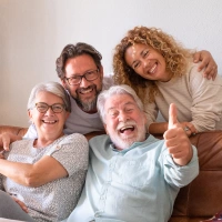 Happy family smiling together representing general dentistry services
