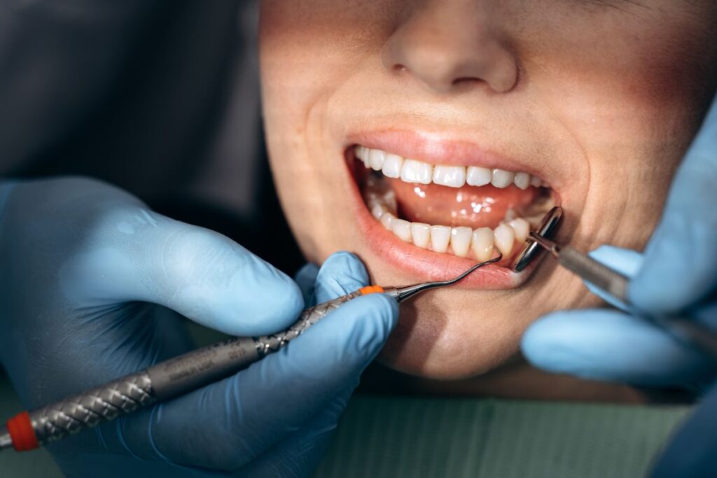 Dentist performing cosmetic dental treatment on patient's smile in Henderson, NV.